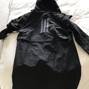 A new adidas raincoat with a tag never worn